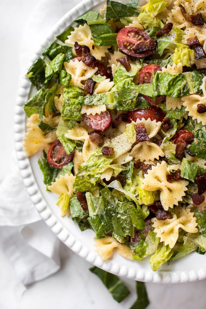 BLT bowtie pasta salad close-up of crispy bacon, lettuce, and tomatoes and smoky creamy dressing