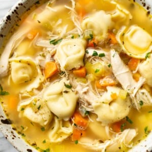 a bowl of chicken tortellini soup