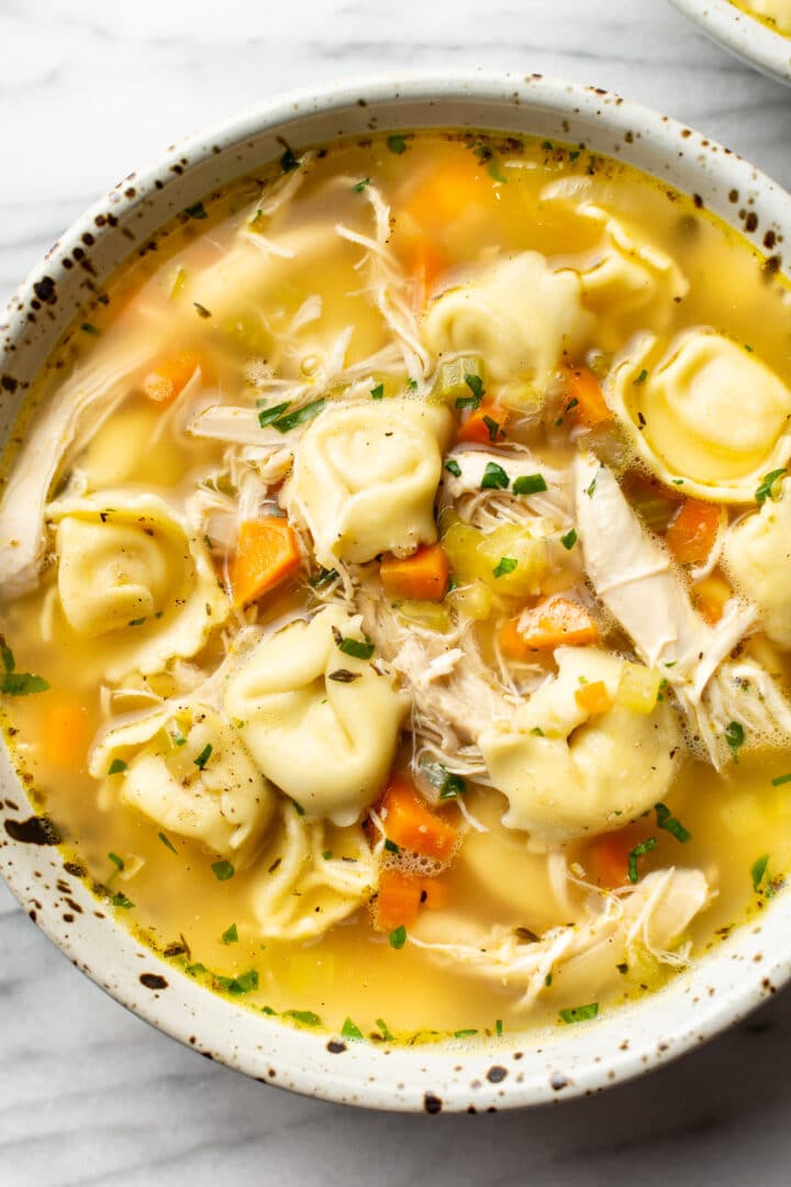 a bowl of chicken tortellini soup