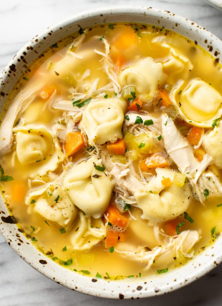 a bowl of chicken tortellini soup