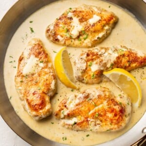 creamy lemon chicken in a copper skillet