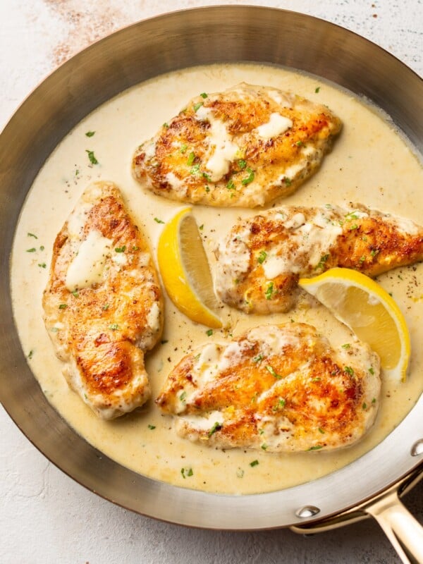 creamy lemon chicken in a copper skillet