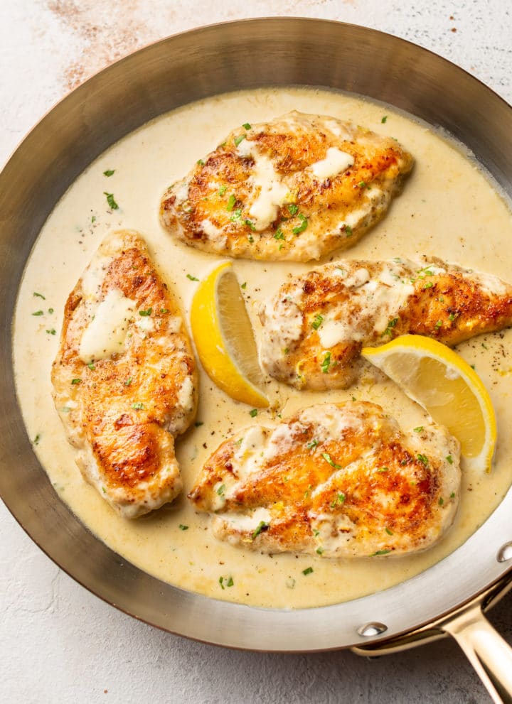 creamy lemon chicken in a copper skillet