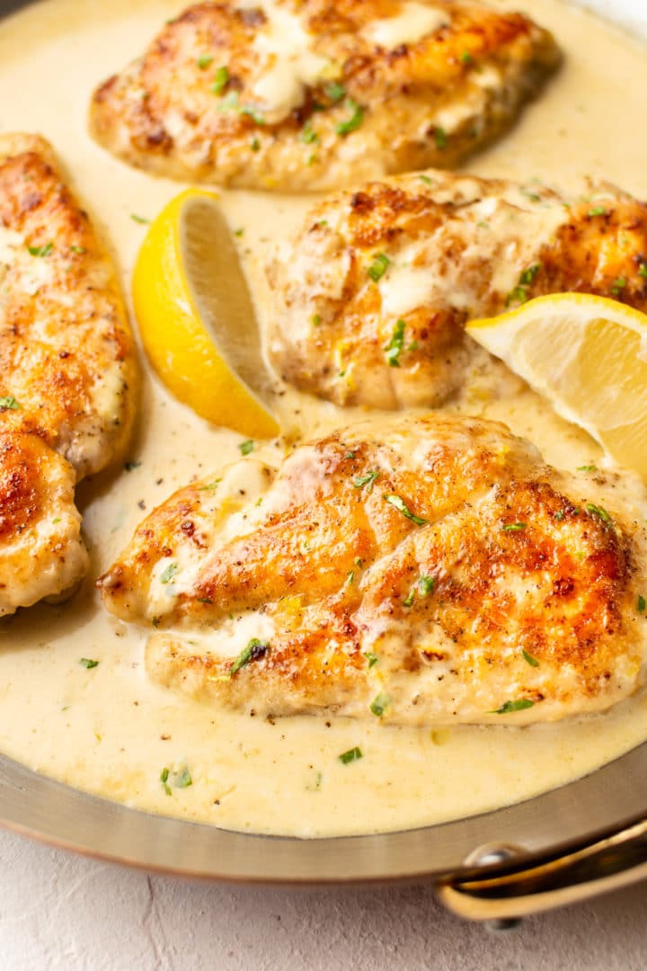 close-up of pan-fried chicken in a lemon cream sauce