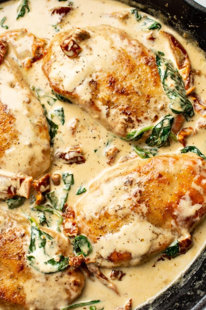 closeup of creamy tuscan chicken in a skillet