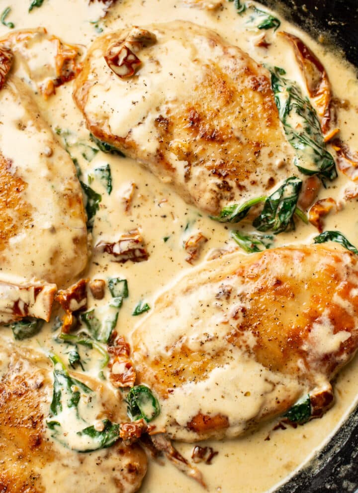 closeup of creamy tuscan chicken in a skillet