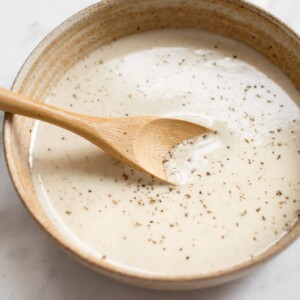 This simple vegan lemon tahini dressing is perfect on salads, roasted vegetables, and grains. It's healthy and delicious. Sweeten it with honey or maple syrup, and add as much garlic as you wish. You can thin it to your desired consistency. Quick & easy!