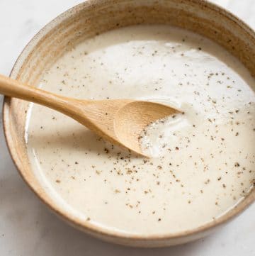This simple vegan lemon tahini dressing is perfect on salads, roasted vegetables, and grains. It's healthy and delicious. Sweeten it with honey or maple syrup, and add as much garlic as you wish. You can thin it to your desired consistency. Quick & easy!