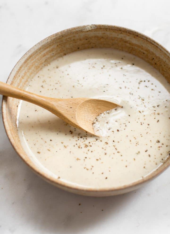 This simple vegan lemon tahini dressing is perfect on salads, roasted vegetables, and grains. It's healthy and delicious. Sweeten it with honey or maple syrup, and add as much garlic as you wish. You can thin it to your desired consistency. Quick & easy!