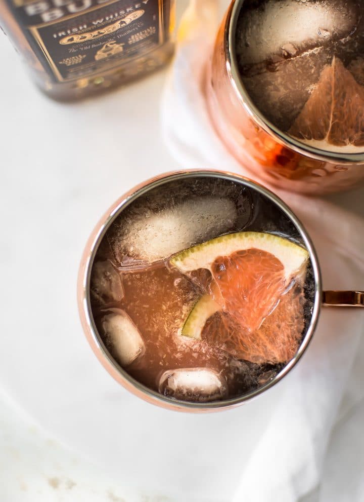 This grapefruit Irish Mule cocktail is a delicious variation of the classic Moscow Mule; it uses Irish whiskey instead of vodka. The perfect refreshing and easy to make party drink. Great for St. Patrick's Day or any day of the year. If you love ginger beer, you will love this cocktail!