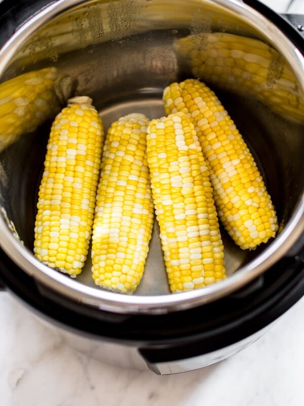 It's fast and easy to cook corn on the cob in your Instant Pot! You will love this method for cooking perfect corn every time. This healthy summer side dish recipe is perfect for BBQs or potlucks. 