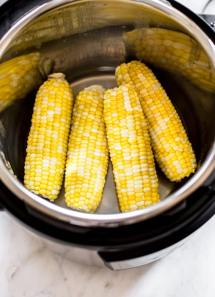 It's fast and easy to cook corn on the cob in your Instant Pot! You will love this method for cooking perfect corn every time. This healthy summer side dish recipe is perfect for BBQs or potlucks. 
