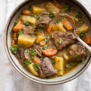 This Instant Pot Irish stew has tender beef, potatoes, carrots, and a delicious traditional Guinness sauce. You will love this simple stew recipe! It's perfect for St. Patrick's Day or any occasion where you want a comforting beef stew recipe. The electric pressure cooker makes this authentic recipe so easy to make. 