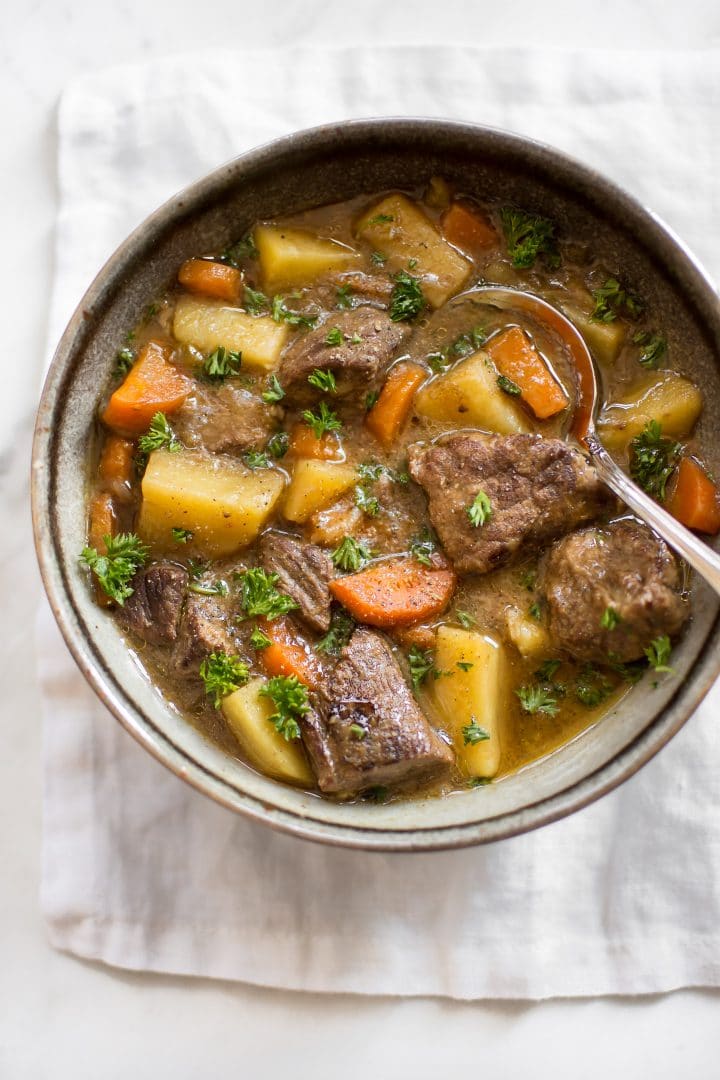 close-up of bowl with Instant Pot Irish stew and spoon