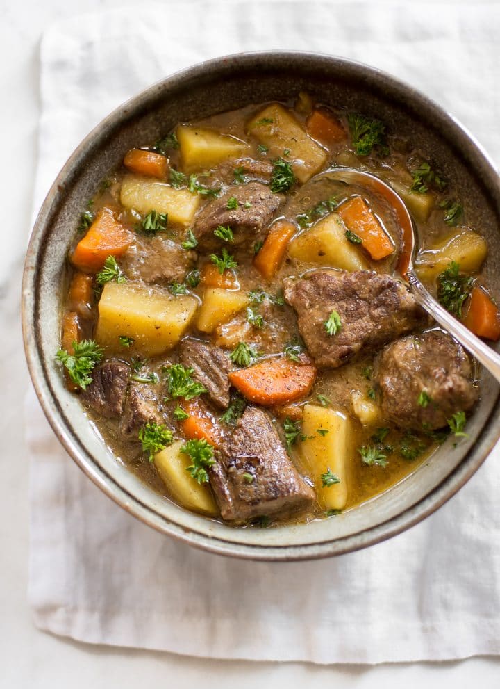 This Instant Pot Irish stew has tender beef, potatoes, carrots, and a delicious traditional Guinness sauce. You will love this simple stew recipe! It's perfect for St. Patrick's Day or any occasion where you want a comforting beef stew recipe. The electric pressure cooker makes this authentic recipe so easy to make. 