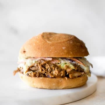 With this easy Instant Pot pulled pork recipe, you can get that slow-cooked taste - fast! This recipe uses pork shoulder, a delicious dry rub, and liquid smoke for the best tender, juicy, and fall apart pulled pork. This electric pressure cooker pulled pork makes an awesome simple family meal.