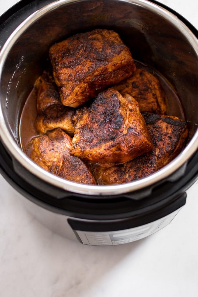 pork shoulder with a dry rub in an Instant Pot electric pressure cooker