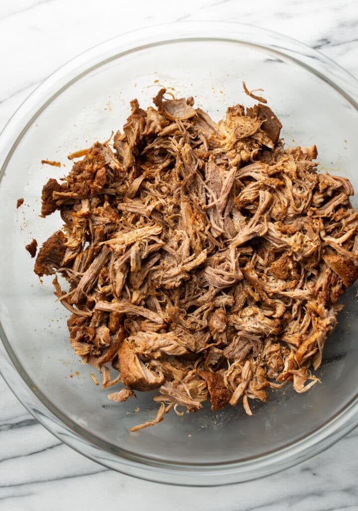 pulled pork in a large glass bowl