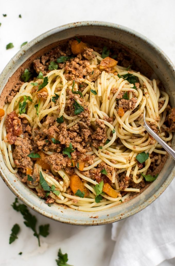 close-up of Instant Pot spaghetti and sauce in a bowl with a fork