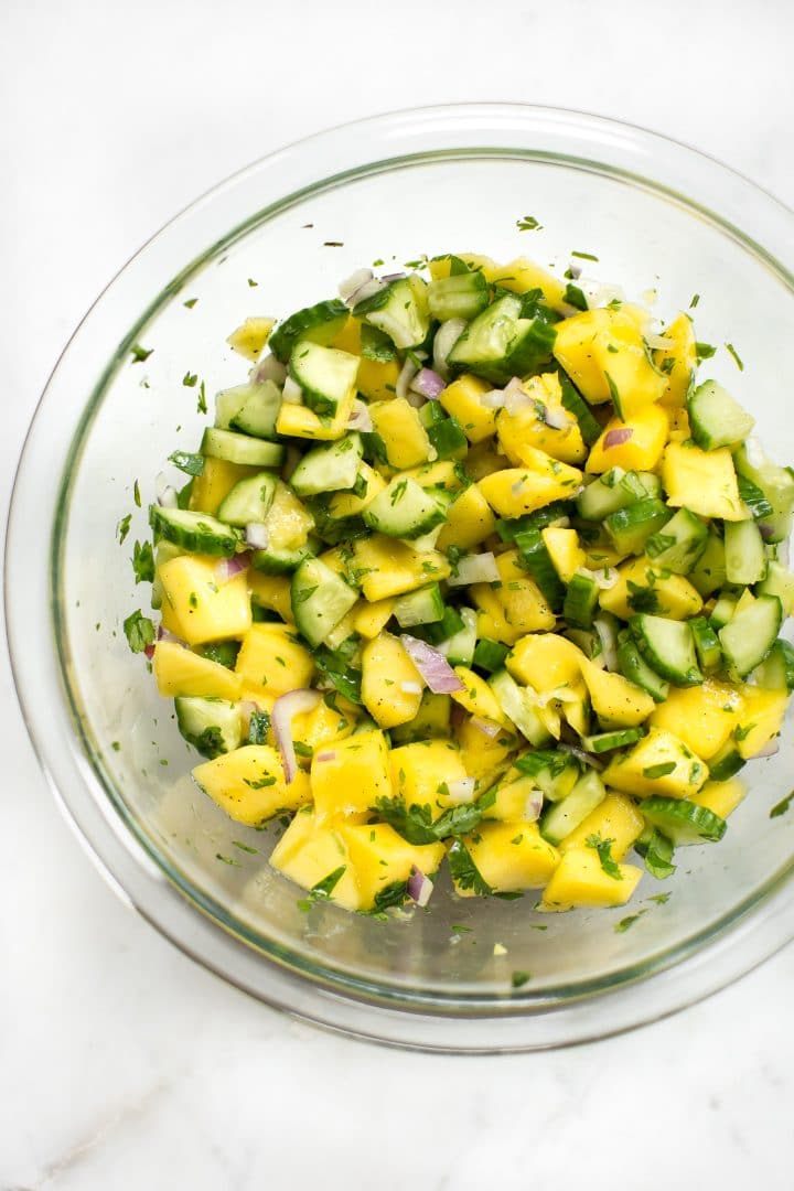 glass mixing bowl with healthy mango vegan salsa