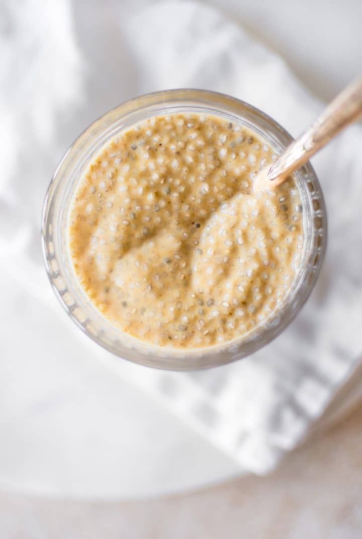 close-up of vegan pumpkin chia pudding in a glass jar