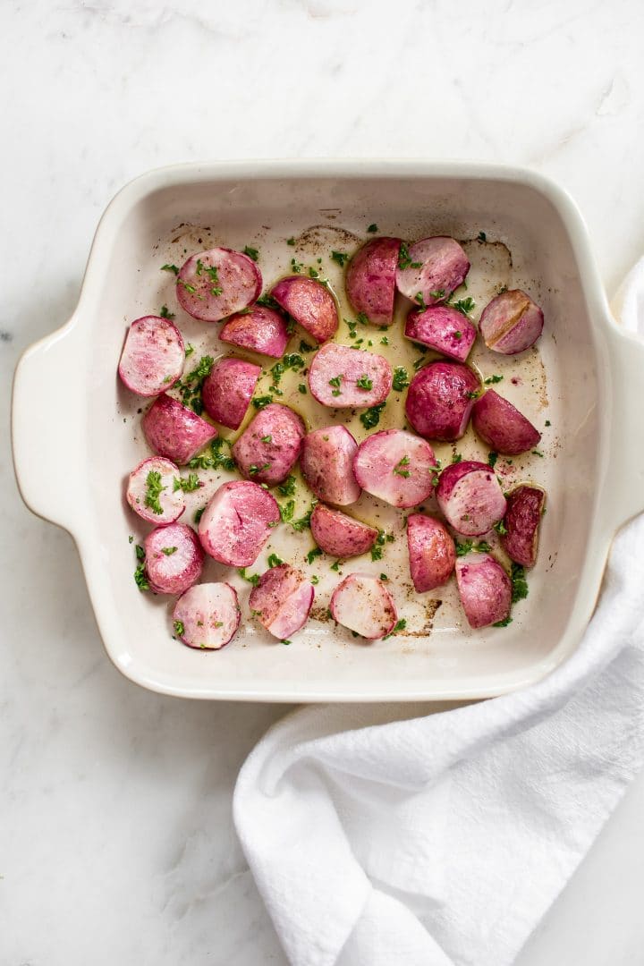 simple roasted radishes in a baking dish