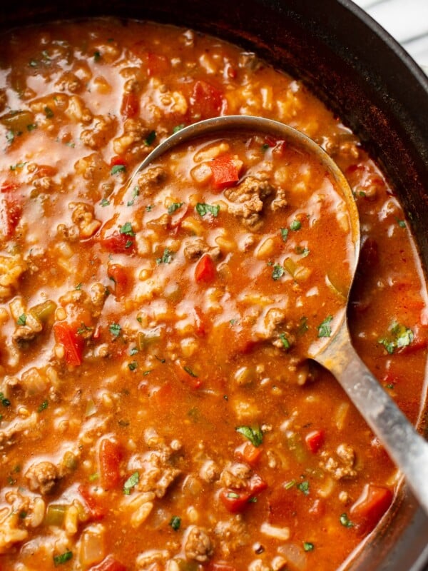 close-up of a ladle of stuffed pepper soup in a pot