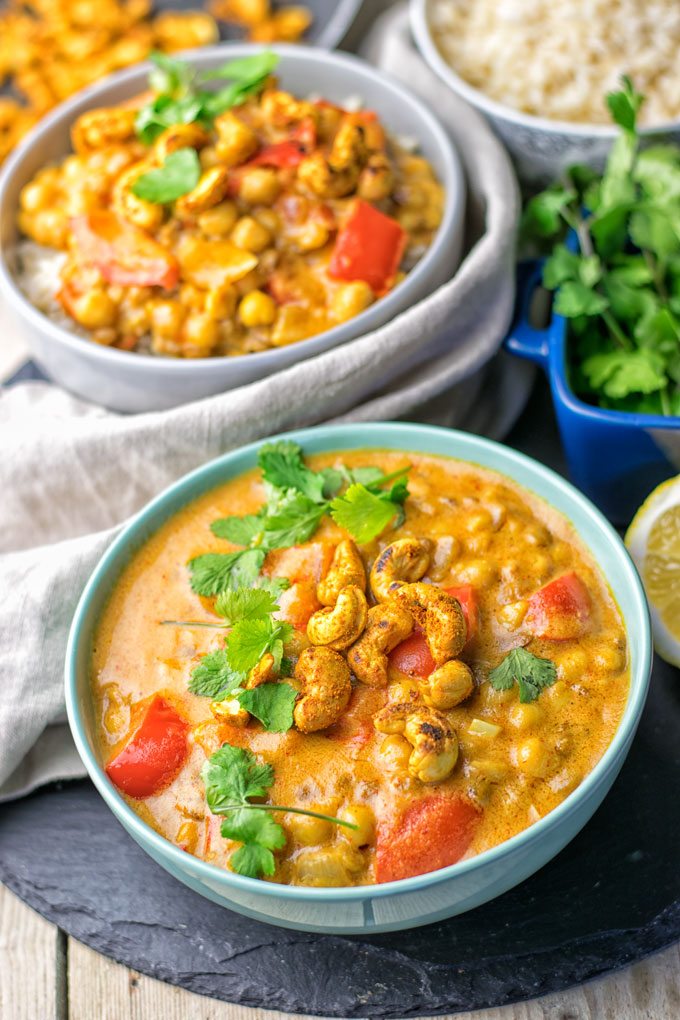 lentil chickpea curry in two bowls beside rice