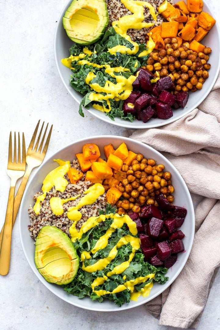 two sheet pan Buddha bowls with forks