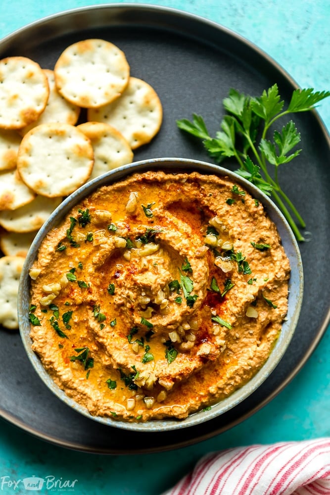 Muhammara walnut dip in a bowl with crackers