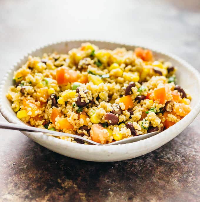 bowl with southwest couscous salad and a spoon