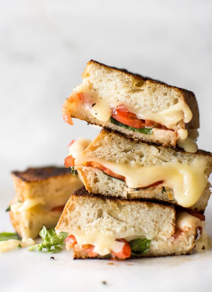 This gourmet Caprese grilled cheese sandwich is made with mayo instead of butter to get an ultra-crispy crust! This vegetarian recipe is quick, simple, and tasty comfort food. A healthier take on grilled cheese with tomatoes, basil, and fresh mozzarella. 