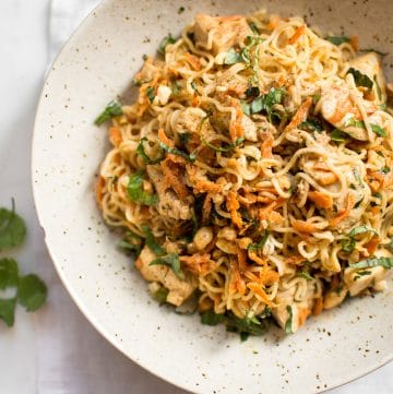 This easy ramen stir fry recipe with chicken is a simple weeknight dinner that's perfect for busy families. Peanut butter, sriracha, soy sauce, lime, garlic, carrots, cilantro, basil, and green onions make this one flavorful dish!