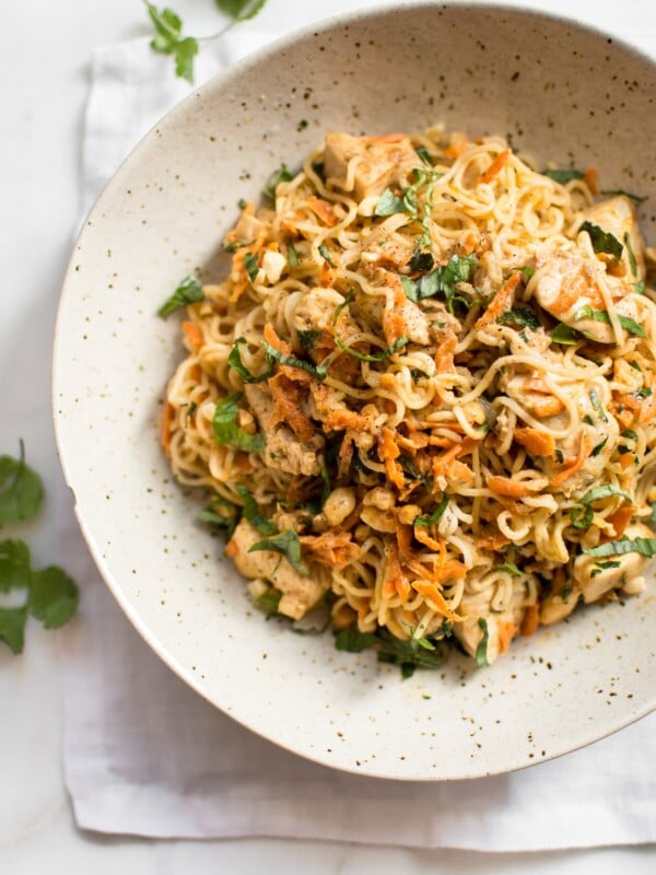 This easy ramen stir fry recipe with chicken is a simple weeknight dinner that's perfect for busy families. Peanut butter, sriracha, soy sauce, lime, garlic, carrots, cilantro, basil, and green onions make this one flavorful dish!