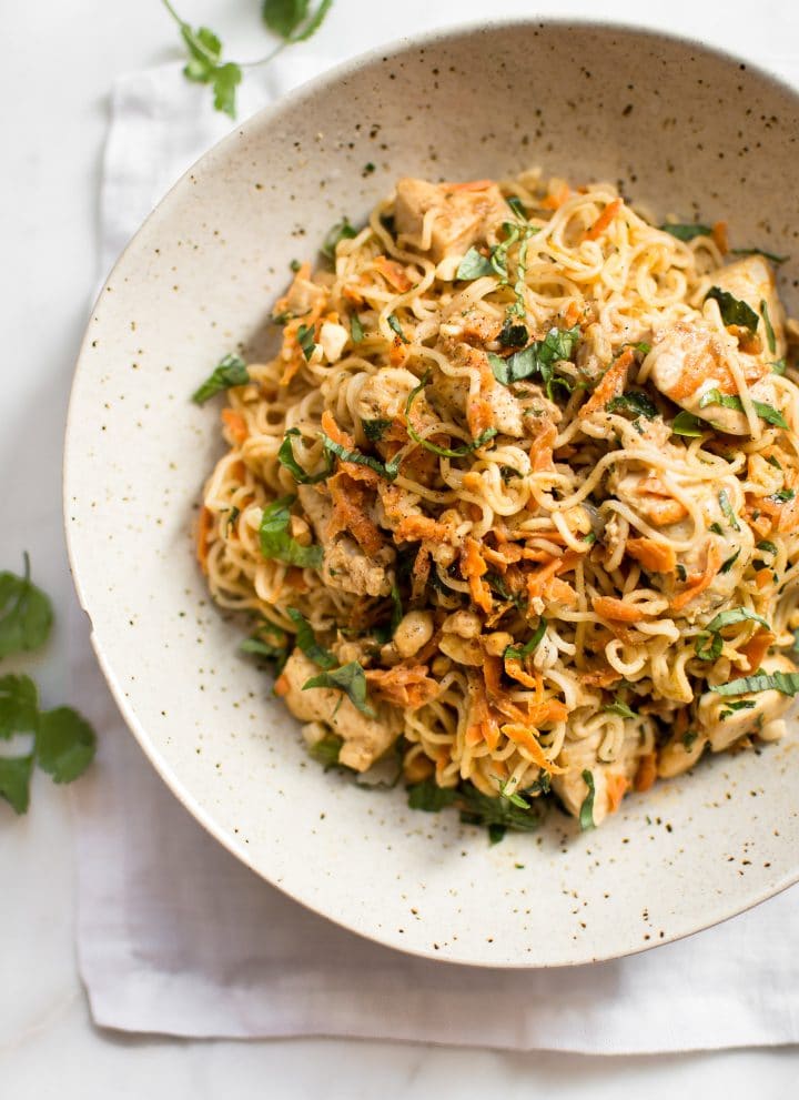 This easy ramen stir fry recipe with chicken is a simple weeknight dinner that's perfect for busy families. Peanut butter, sriracha, soy sauce, lime, garlic, carrots, cilantro, basil, and green onions make this one flavorful dish!