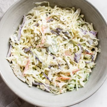 This simple coleslaw recipe has a delicious creamy homemade dressing that's perfectly tangy and sweet. The best classic coleslaw that is perfect for pulled pork, picnics, or BBQs.