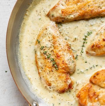 creamy garlic herb chicken in a skillet