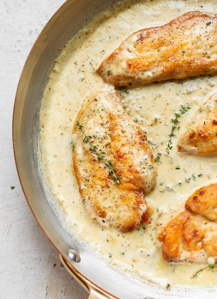 creamy garlic herb chicken in a skillet