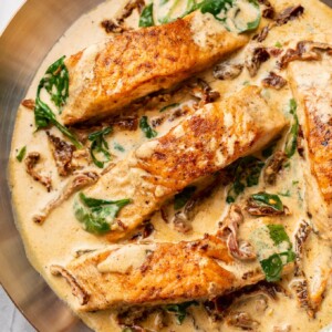 close-up of creamy Tuscan salmon in a skillet