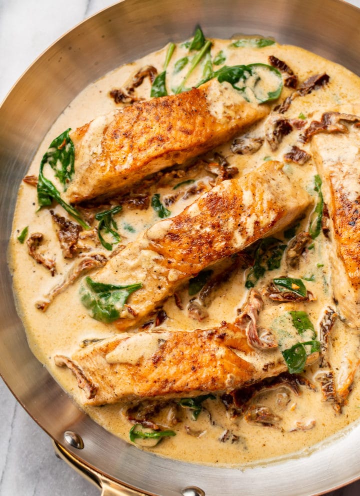 close-up of creamy Tuscan salmon in a skillet
