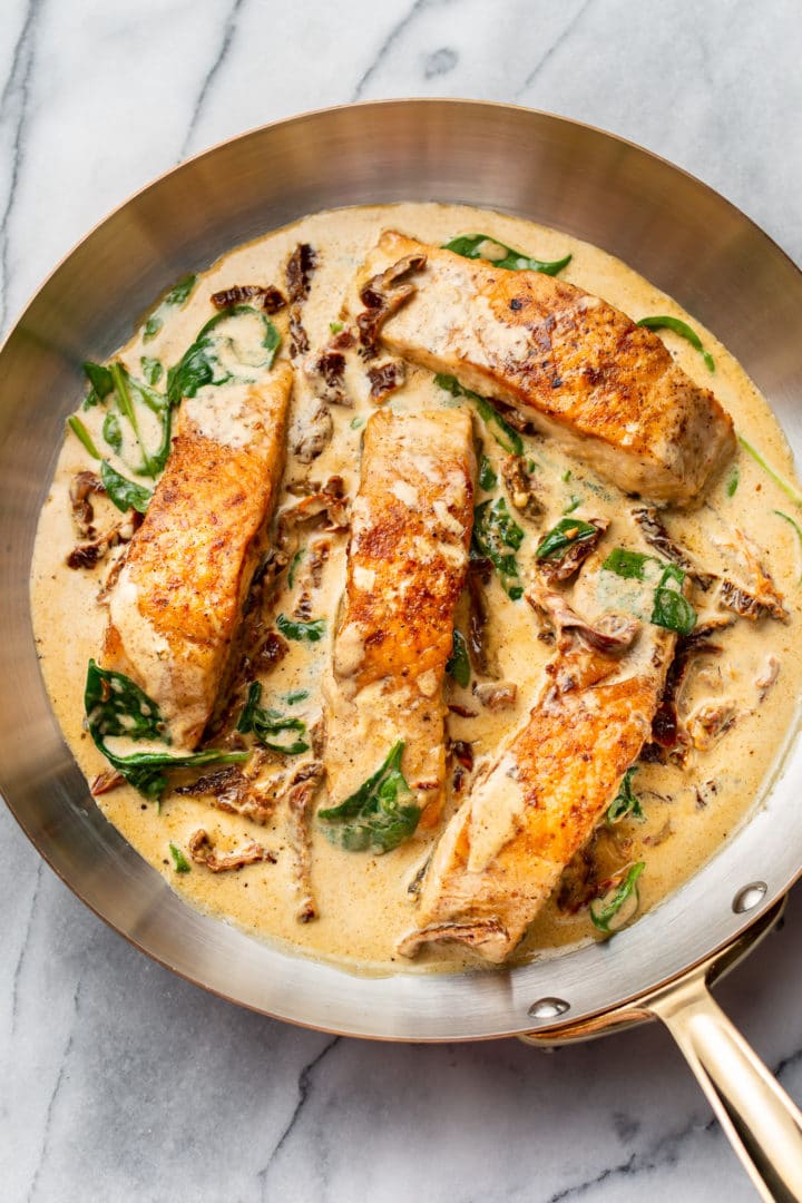 creamy Tuscan butter salmon in a skillet