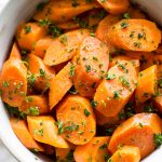 These honey butter steamed Instant Pot carrots are quick and healthy. The perfect easy electric pressure cooker side dish. Great for weeknight family meals or special occasions like Thanksgiving or Christmas dinner.