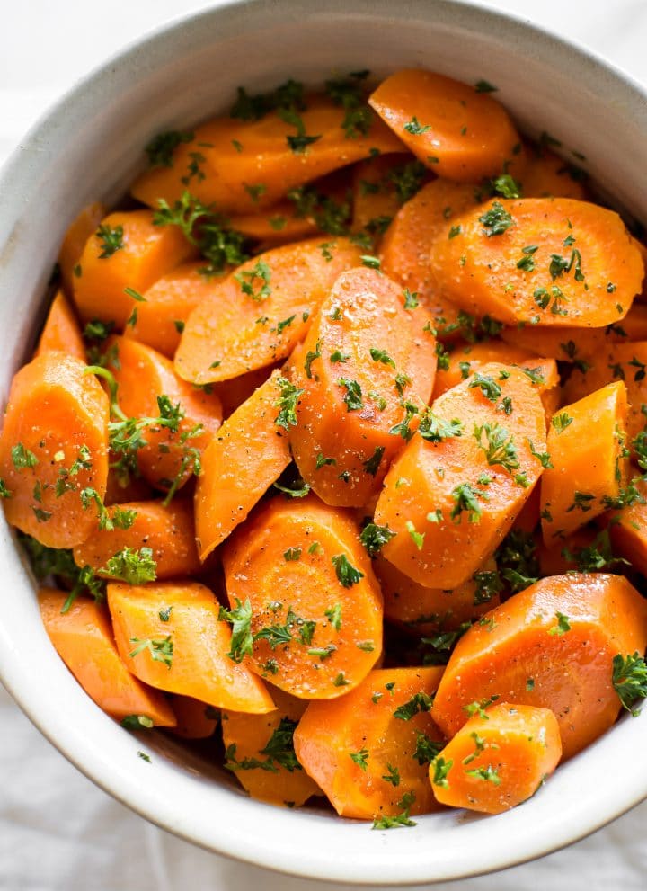 These honey butter steamed Instant Pot carrots are quick and healthy. The perfect easy electric pressure cooker side dish. Great for weeknight family meals or special occasions like Thanksgiving or Christmas dinner.