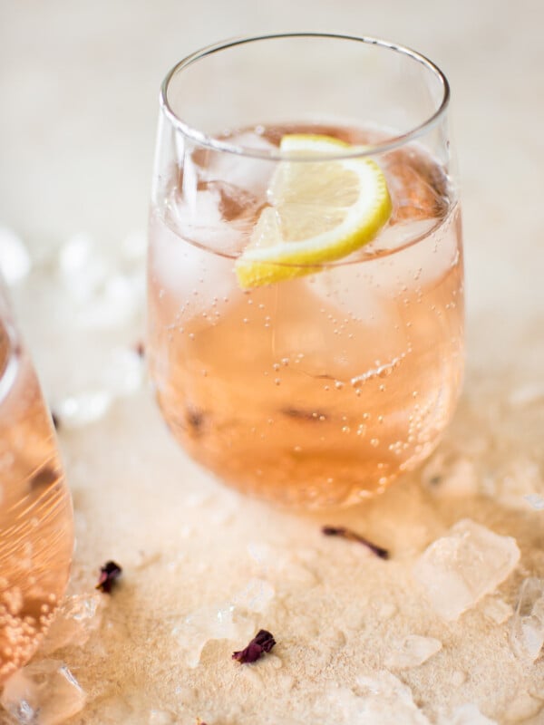 This easy, low-calorie rosé wine spritzer recipe makes the best summer drink. This blush skinny drink is made with sparkling club soda. It's perfect for girls' night or party! 