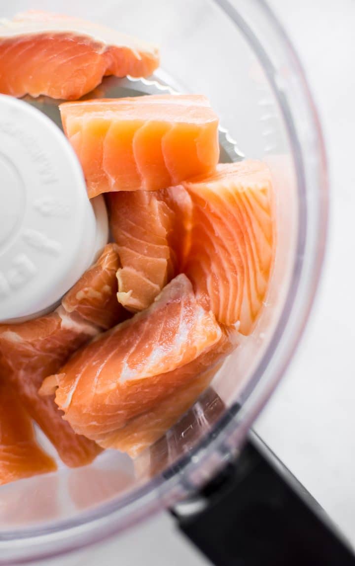 close-up of raw salmon in a food processor