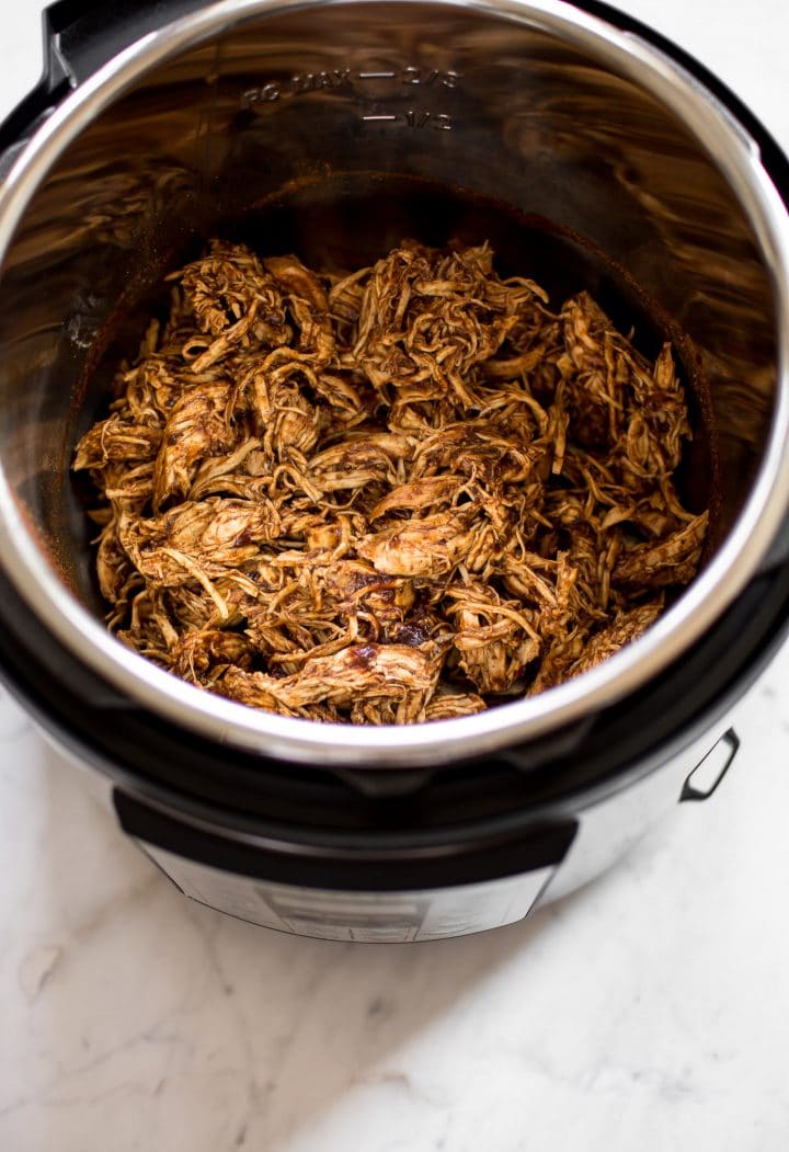 shredded barbecue chicken inside an Instant Pot pressure cooker
