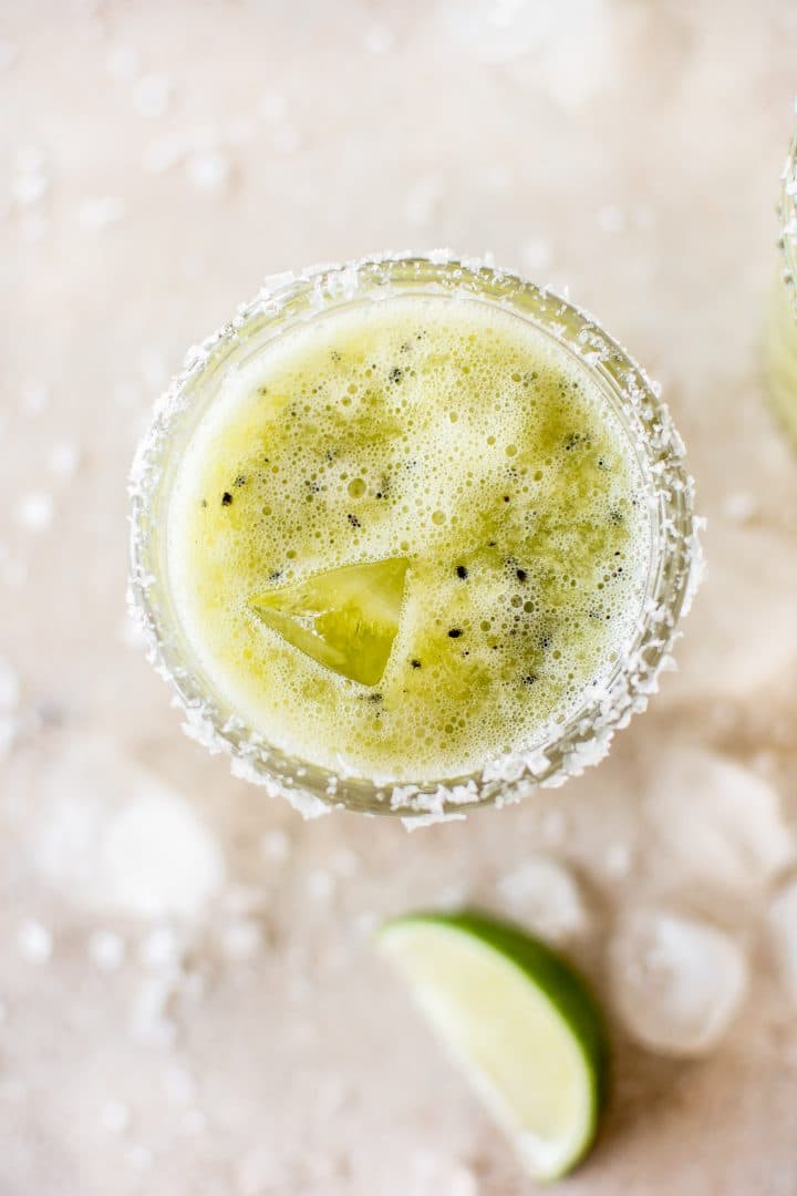 close-up of salt rim on a kiwi margarita glass