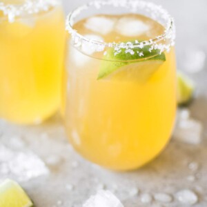 A fast and delicious passion fruit margarita recipe! The perfect easy drink for summer cocktails or Cinco de Mayo. Made with triple sec, tequila, fresh lime juice, and passion fruit juice.