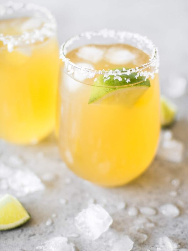 A fast and delicious passion fruit margarita recipe! The perfect easy drink for summer cocktails or Cinco de Mayo. Made with triple sec, tequila, fresh lime juice, and passion fruit juice.