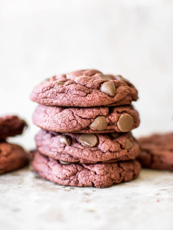 Soft, chewy, easy 3-ingredient (chocolate chips optional) red velvet cake mix cookies are quick and delicious. Perfect for Valentine's Day, Christmas, or any occasion. Duncan Hines boxed cake mix makes the best cookies!